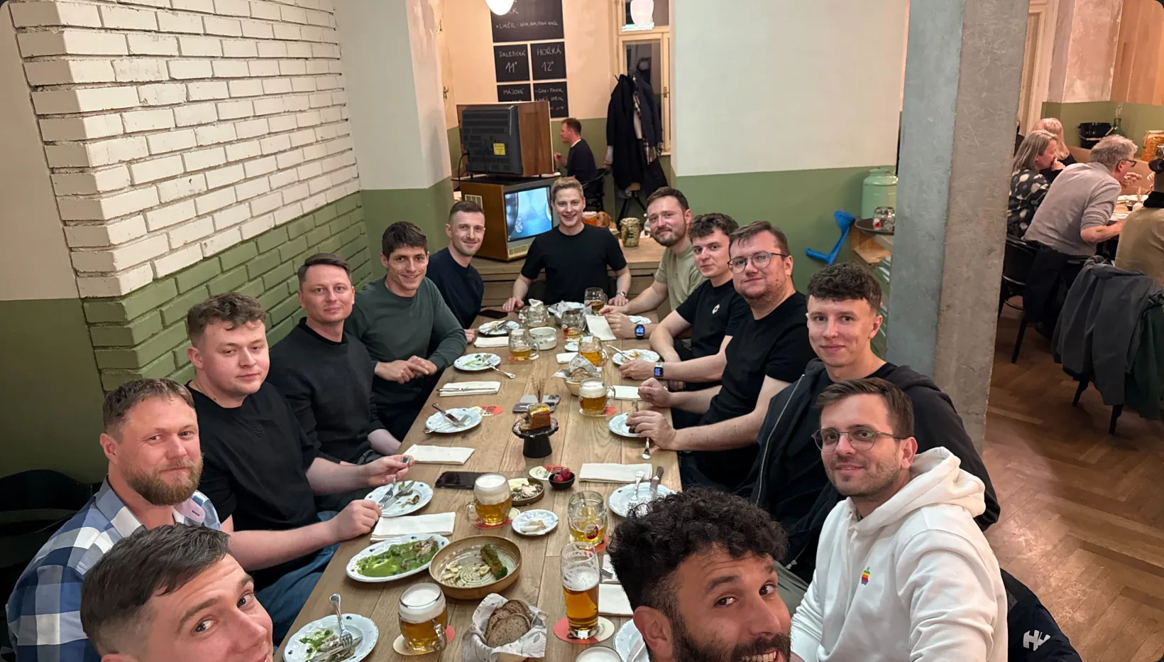 The E2B team sharing dinner around a long table